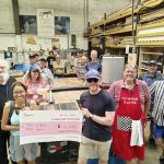 Members of Men in Sheds MK celebrating a £14,432 grant from The National Lottery Community Fund, which has helped us invest in new workshop equipment, PPE and maintenance.