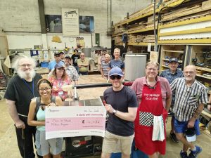 Members of Men in Sheds MK celebrating a £14,432 grant from The National Lottery Community Fund, which has helped us invest in new workshop equipment, PPE and maintenance.